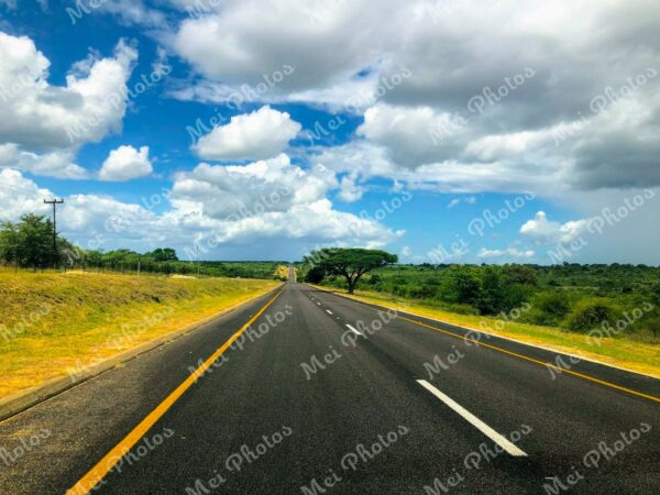 Empty road with blue sky and clouds on roadtrip in South Africa 23