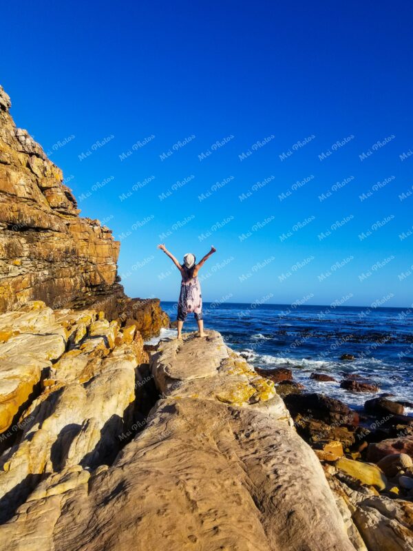 Woman Standing On Rock At Cape Point Beach In South Africa